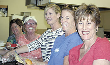 Meanwhile, inside these ladies volunteered to fill the orders for the highlighted BBQ chicken dinner. Plates included all the fixins and dessert. Pictured (l to r): Myra Wright, Beverly Phillips, Andrea Reno, Dee Greene, and Beth Mayo. 
