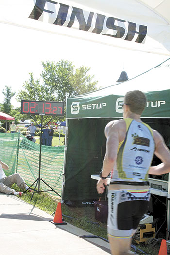 Matt Patton, #9, crossed the triathlon finish line 1/100 of a second after this photo. to claim his victory.