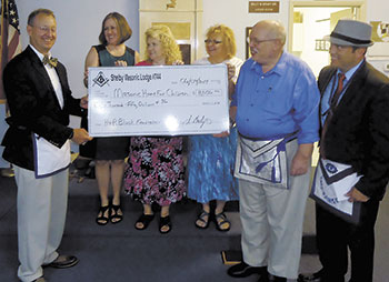 L-R: Chris Richardson, H & R Block representatives: Grace Costner, Rebecca Pearson, and Cathy McCarty and Shelby Masonic Lodge officers: Ed Burk and Greg McIntyre