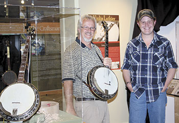 Chris Testerman, (left) is explaining his craft to a fellow luthier Warren Yates of Hickory, NC (right) at the Earl Scruggs Centerâ€™s special.
