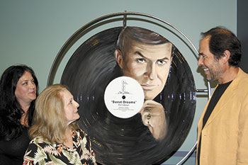 Pictured with Bobbi Gibson are the creators of the â€œSweet Dreamsâ€ record art, Mary Sparrow Robles (left) and Geoff Robles.  - M.A. Andrews