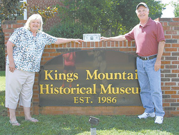 Steve Sanders and wife Ilene hold their check at the Kings Mountain Historical Museum a few days after winning the big prize at the reverse raffle held a few days earlier. Photo by Don Crawford