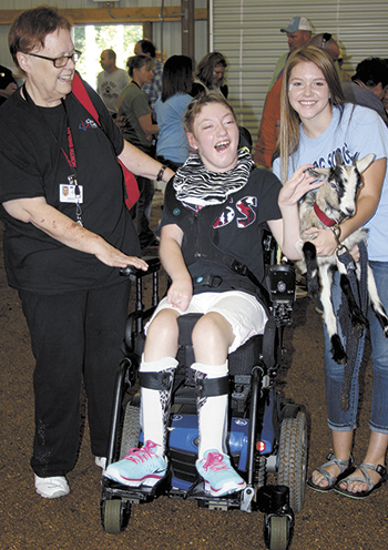 North Shelby student, Hannah Conley was thrilled  to participate in the 3rd annual Phyllis Elmore  Special Livestock show and loved her goat.