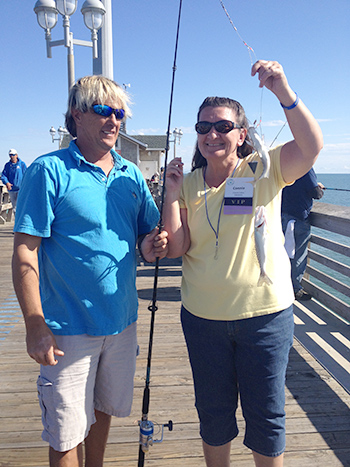 A volunteer with Connie Collins of Kings Mountain. She caught two fish at the same time!