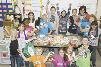 Boiling Springs Elementary Schoolâ€™s third grade classmates of Asher Smith show off some of the 90,000 pennies they have already collected.
