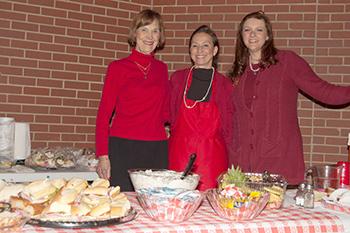 At last year's Valentine's Luncheon, Kathy Woody of "Dressings On The Side" Catering, flanked by Mary Jane Darr and Jackie Sibley with the meal prepared especially for the Carrousel event.
