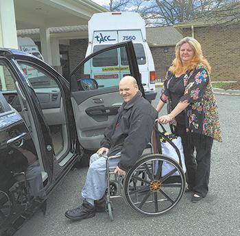 Bruce Thomas being transported by Michelle Hoyle 