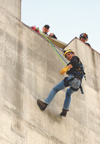 Aaron Walker from Grover gets practice on working a solid wall in safety gear.