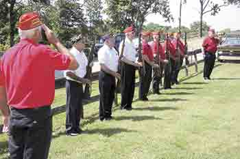 John Beck plays taps as other members of the Marines Corp League Foothills Detachment salute at the Casar Memorial Day Ceremony and dedication of the new Veterans Memorial at Casar Park.