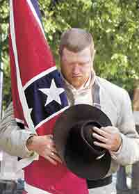 Scott Hamby Commander of Burke Tigers Camp 2162 and member of the Honor Guard prays during the invocation at the Confederate Memorial Day.
