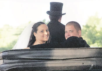 Mischia and Greg Taylor not only got engaged in a horse-drawn carriage, but they also rode in a carriage on their wedding day. 