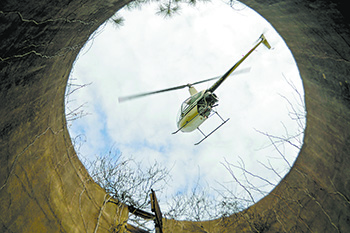 Careful planning and  timing enabled Meade to capture a perfect silo- framed photo of the helicopter.