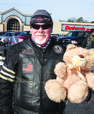 Walt Dyer, with the Wheels of Gracer at the Windjammers Toy Run.  