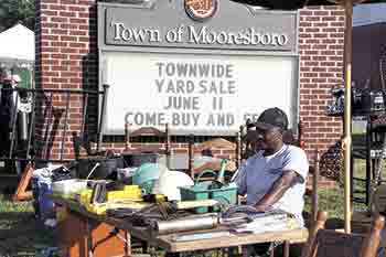 John Downs of Mooresboro welcomes customers during the yard sale.