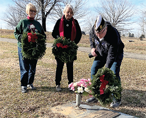 Left to right, Denise Smith and Martha Bridges and Commander Jim Quinlan