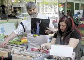 James Gowan and Carole Jolley search for albums.