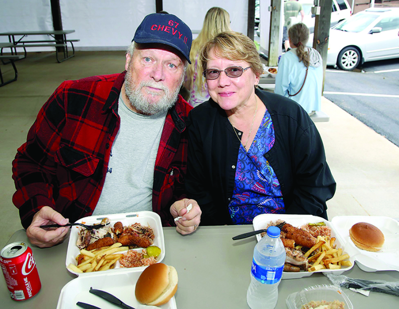 Eddie and Delynn Fitch enjoy BBQ at the Annual Fundraiser at Sulphur Springs Methodist Church on Saturday, Oct. 9th.