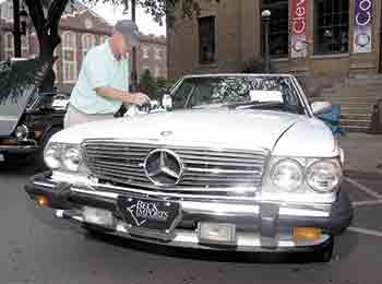 Robert Austin, left, details his 1987 Mercedes during the Broad River European Motor Club Car show.